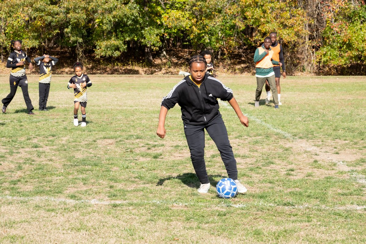 Young player working on ball control during training