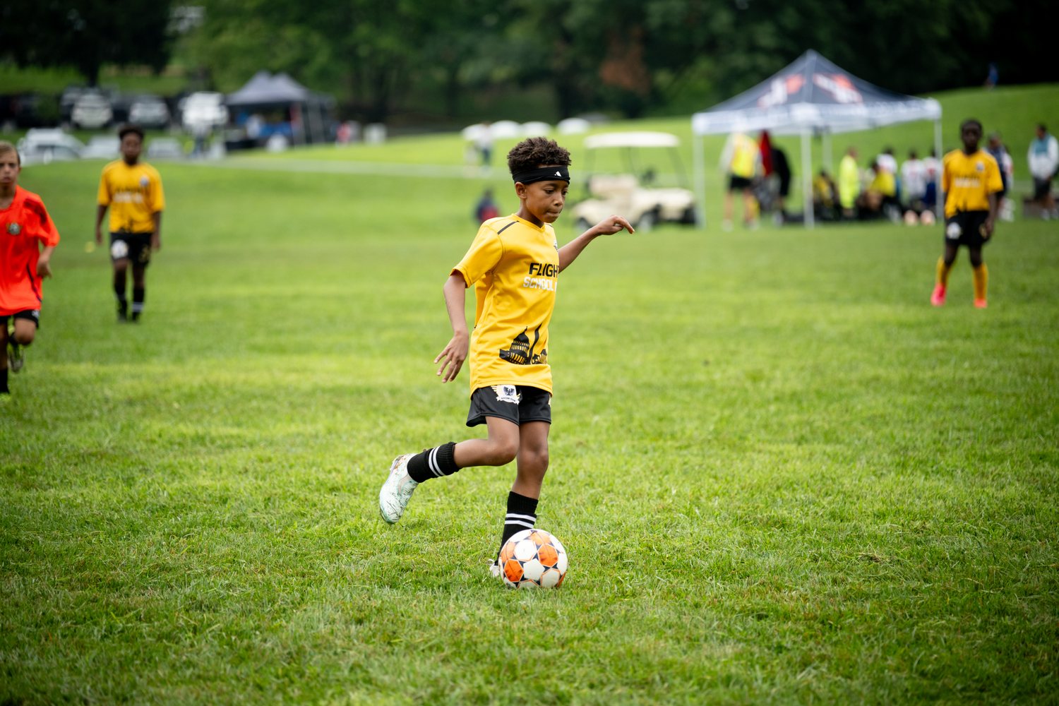 Flight School Project player in yellow lining up a shot