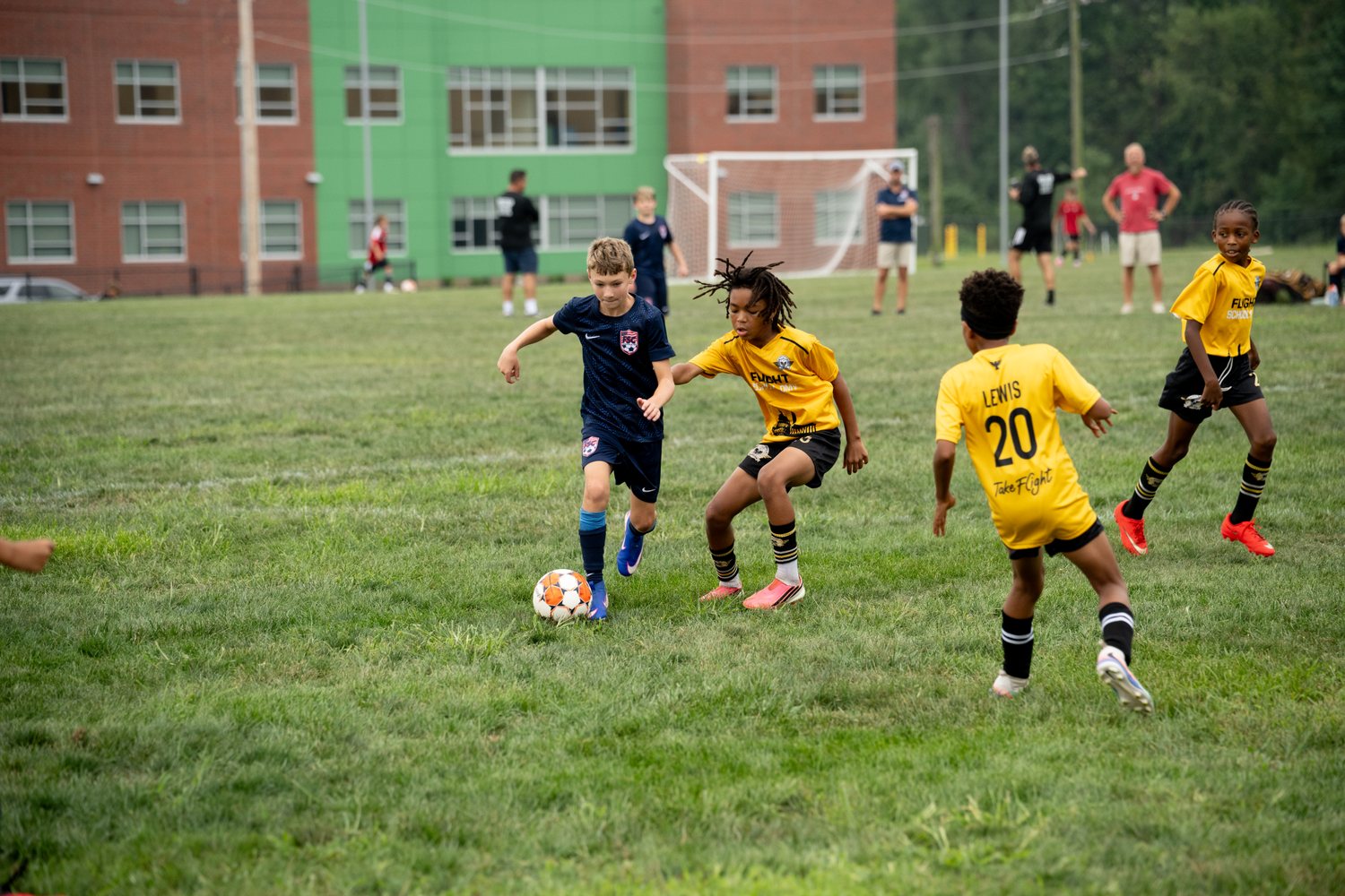 The Flight School Project players competing for the ball